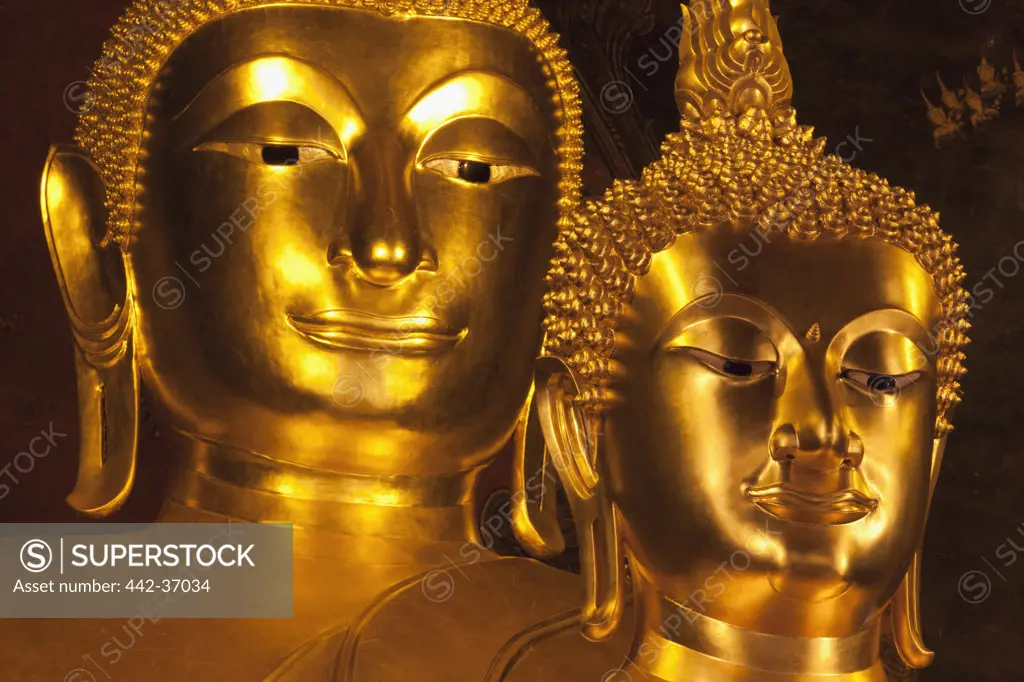 Two golden statues of Buddha in a temple, Wat Bowonniwet, Bangkok, Thailand