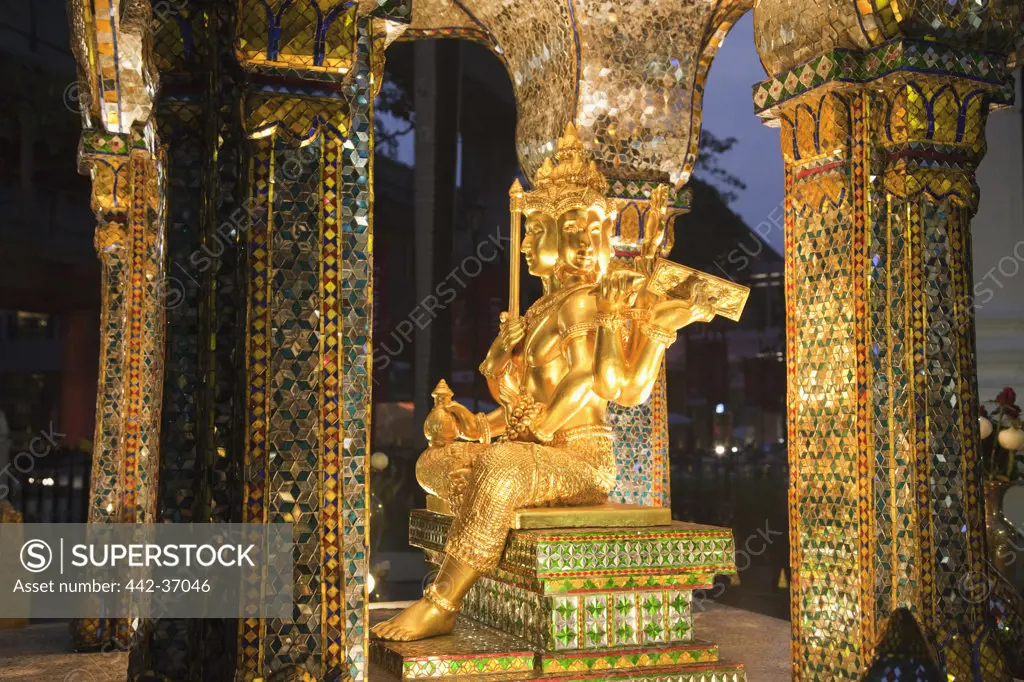 Statue of Hindu God Brahma (Phra Phrom in Thai) in a temple, Erawan Shrine, Bangkok, Thailand