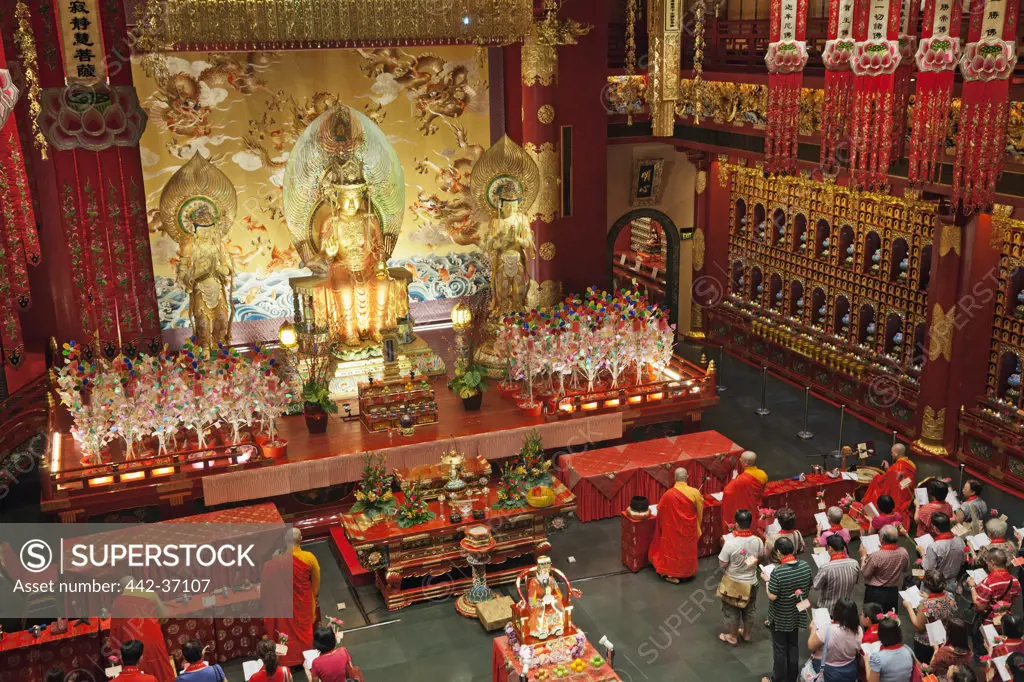 Morning prayer in a Buddhist temple, Buddha Tooth Relic Temple And Museum, Chinatown, Singapore