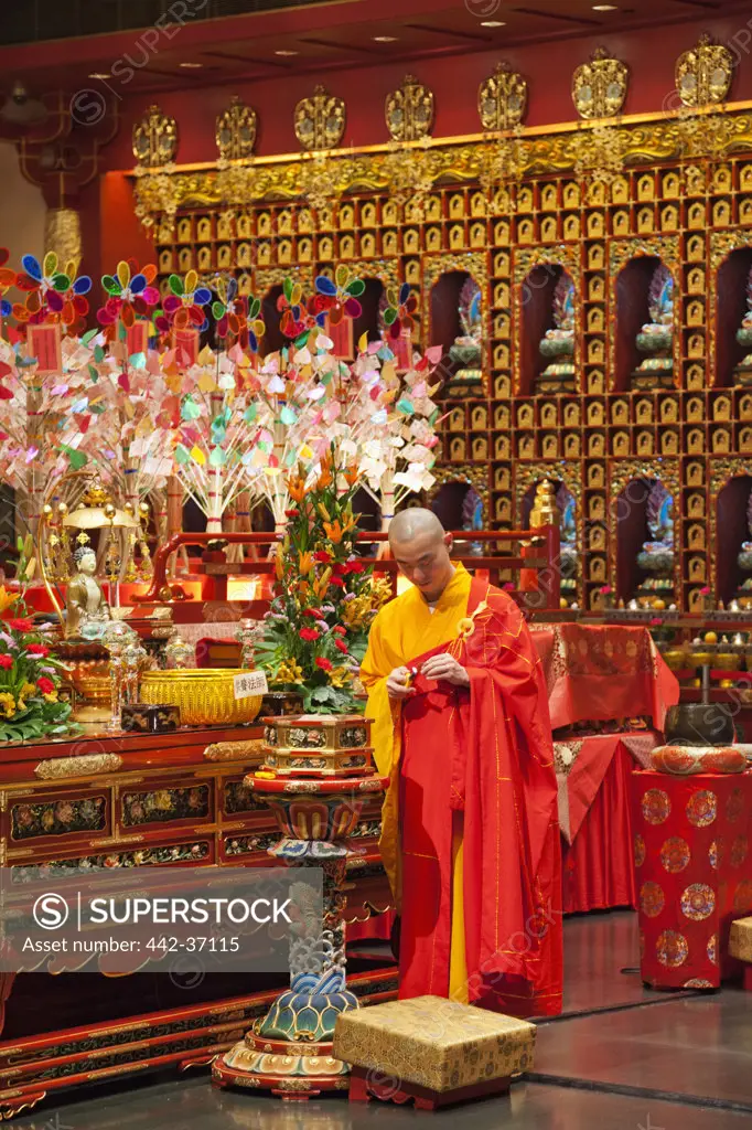 Monk in a Buddhist temple, Buddha Tooth Relic Temple And Museum, Chinatown, Singapore