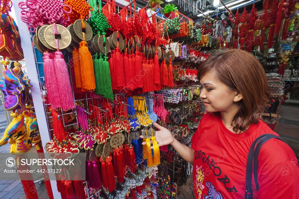 Woman shopping at a souvenir shop, Chinatown, Singapore