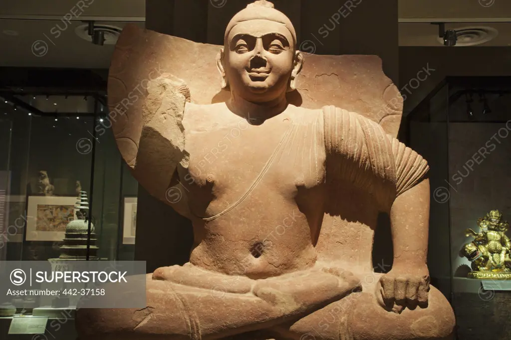 Sandstone seated Buddha Statue in a museum, Asian Civilisations Museum, Singapore