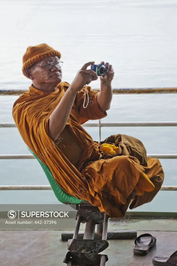 Thailand,Trat Province,Koh Chang,Koh Chang Ferry,Monk Taking Photo