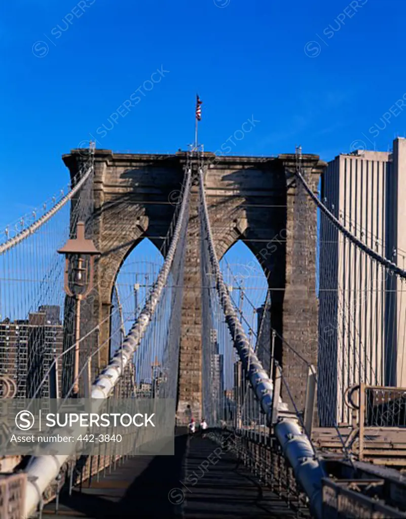 Two people jogging on a bridge, Brooklyn bridge, New York City, New York, USA