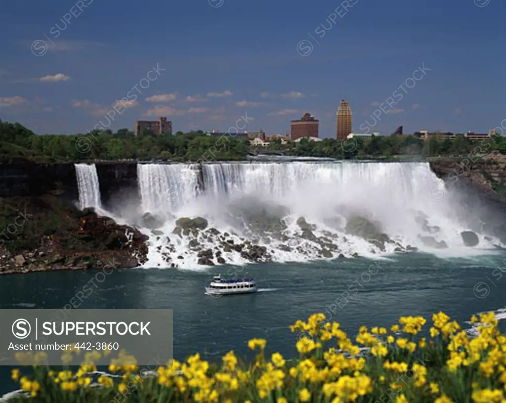 High angle view of a tourboat in front of a waterfall, Niagara Falls, Ontario, Canada