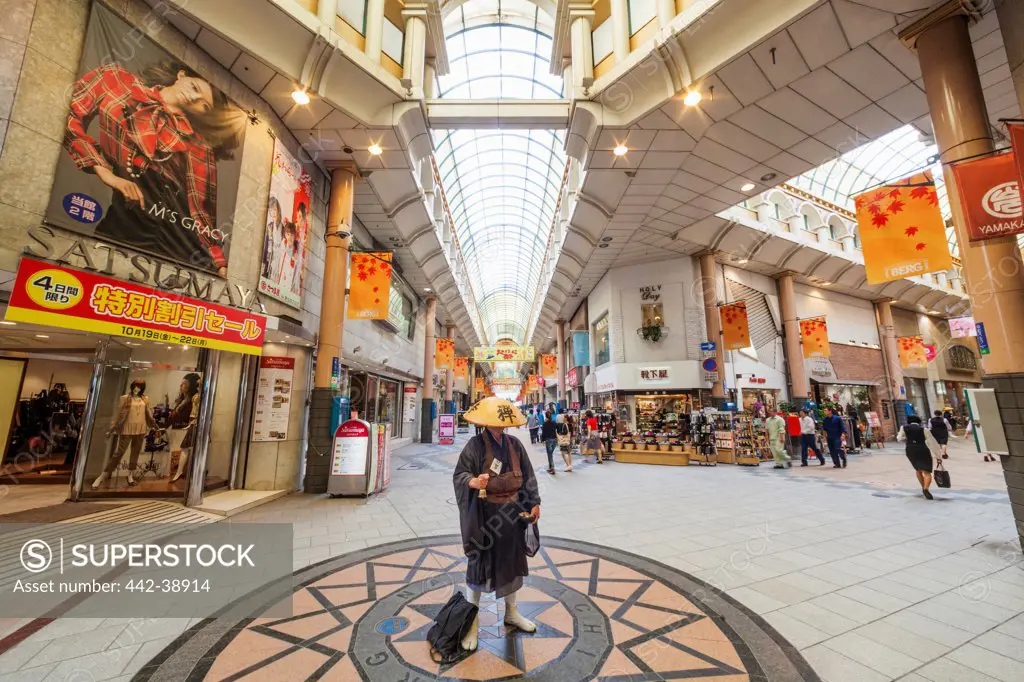 Japan, Kyushu, Kagoshima, Kagoshima City, Tenmonkan-dori Shopping Arcade, Zen Monk Collecting Alms