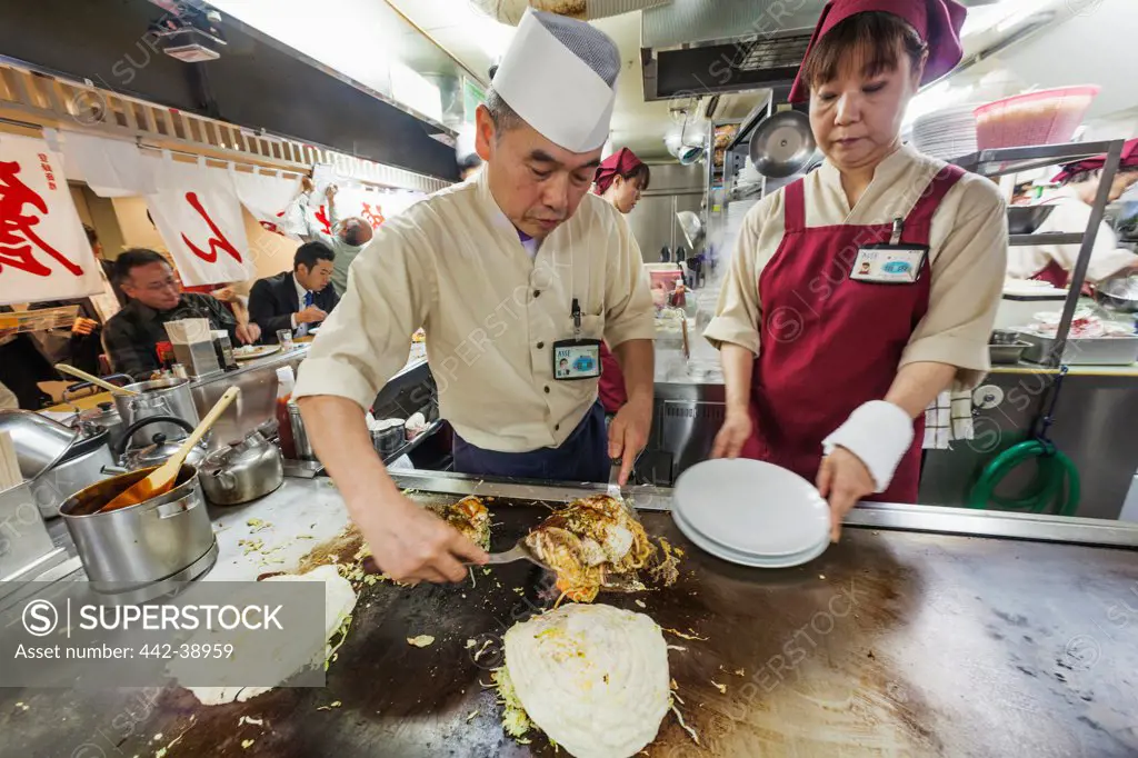 Japan, Kyushu, Hiroshima, Chef Cooking Okonomiyaki