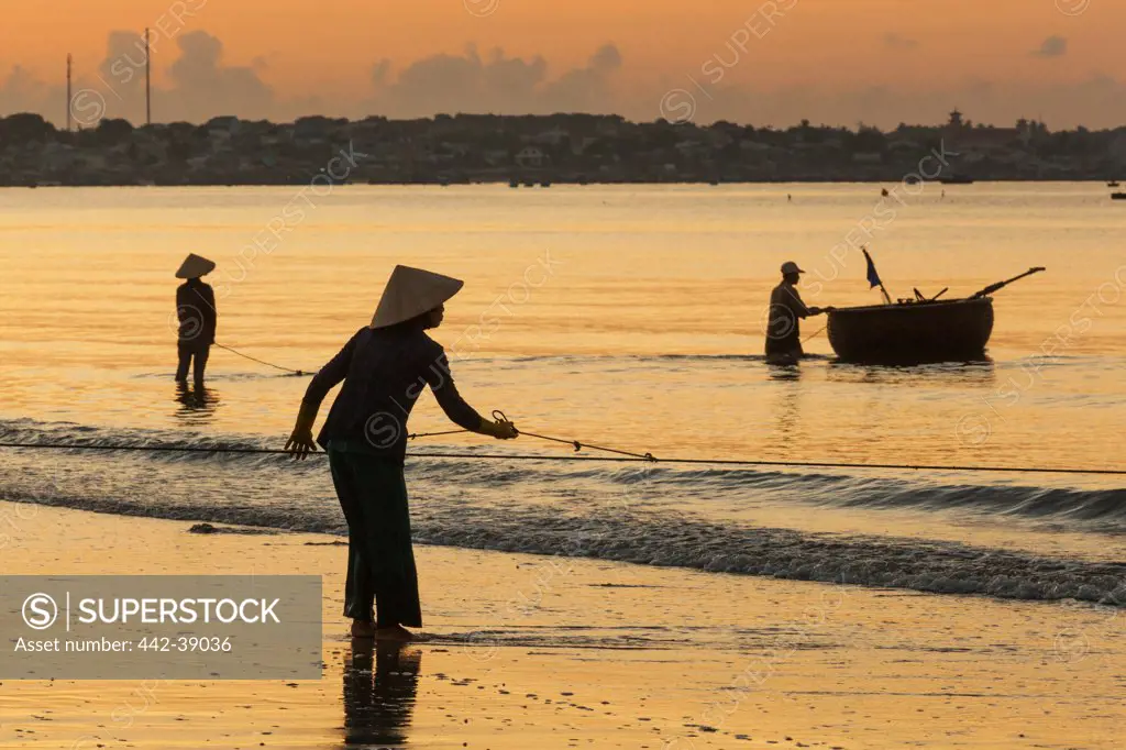 Vietnam, Mui Ne, Mui Ne Beach, Net Fisherwoman at Dawn