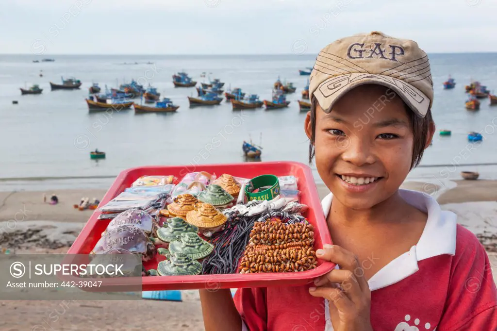 Vietnam, Mui Ne, Mui Ne Beach, Young Child Selling Souvenir Seashells
