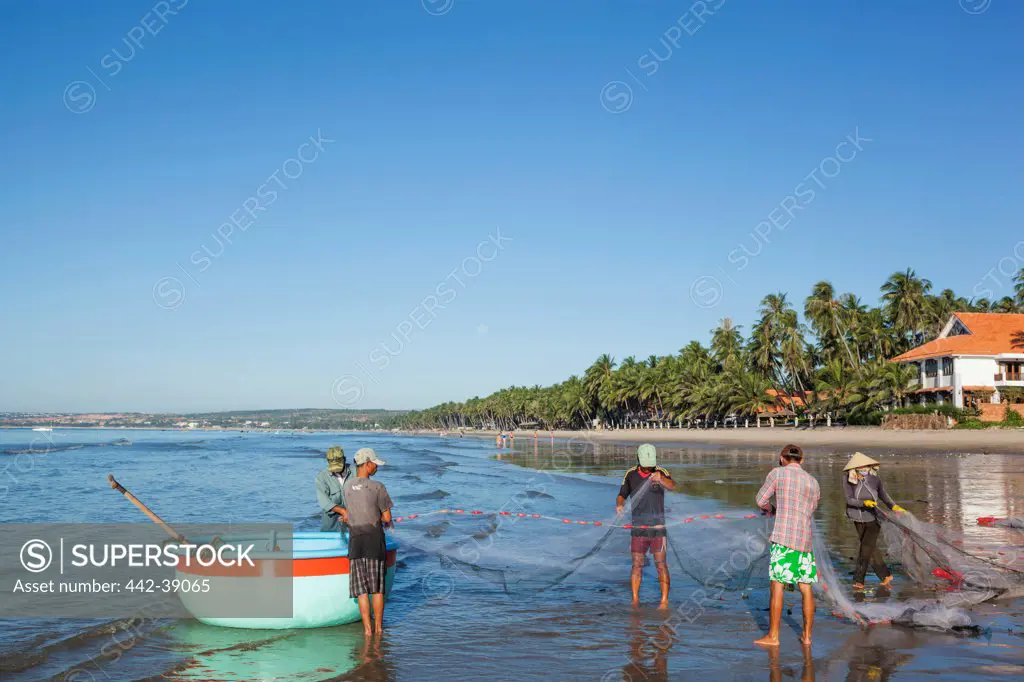 Vietnam, Mui Ne, Mui Ne Beach, Fishermen and Coracle Fishing Boat