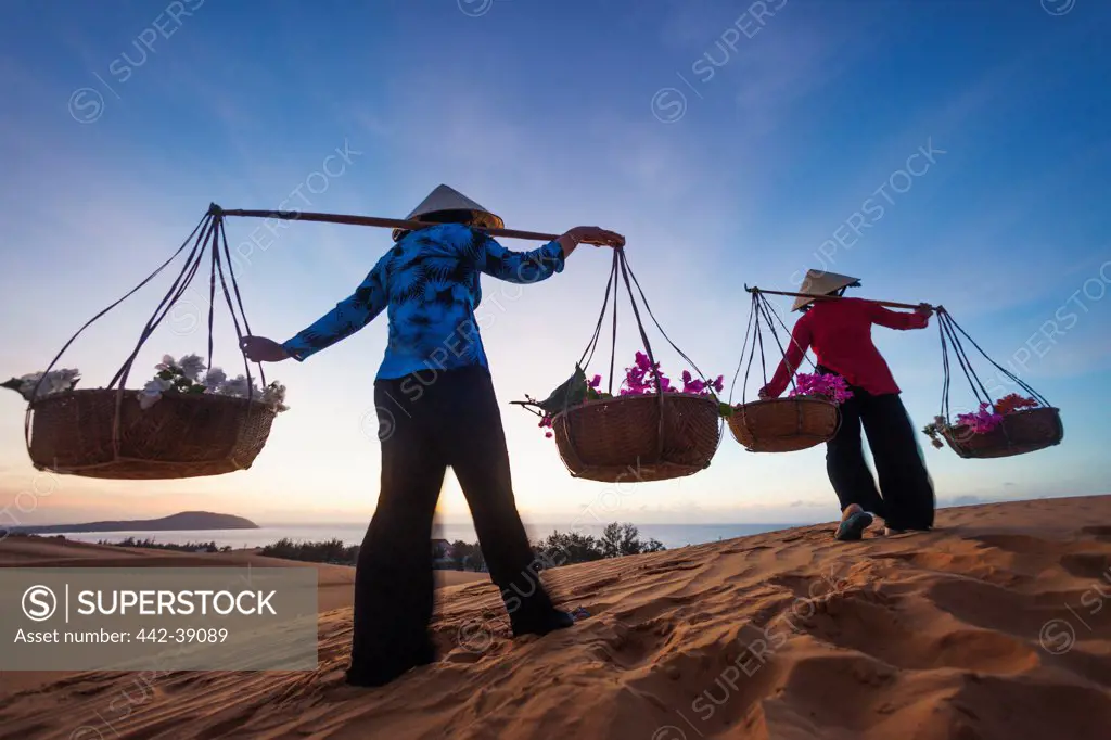 Vietnam, Mui Ne, Sand Dunes and Local Women in Conical Hats