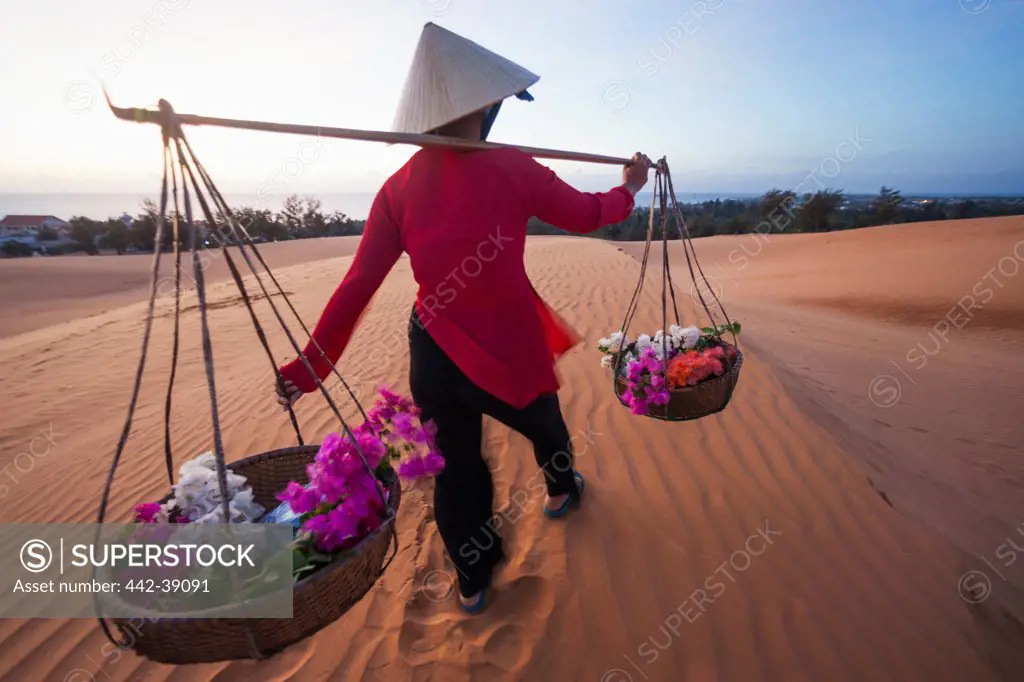 Vietnam, Mui Ne, Sand Dunes and Local Woman in Conical Hat