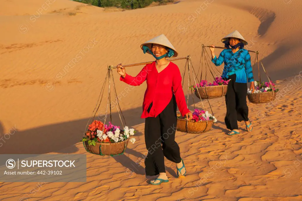 Vietnam, Mui Ne, Sand Dunes and Local Women in Conical Hats