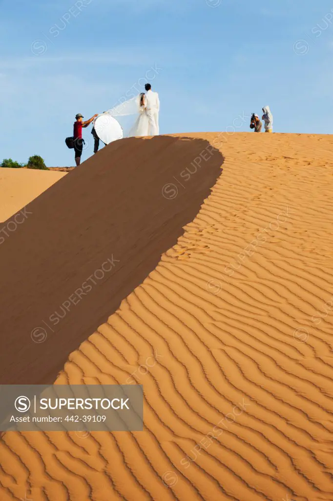 Vietnam, Mui Ne, Sand Dunes and Wedding Couple