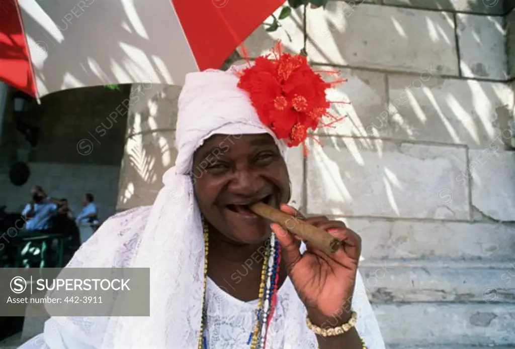 Portrait of a senior woman smoking a cigar, Havana, Cuba
