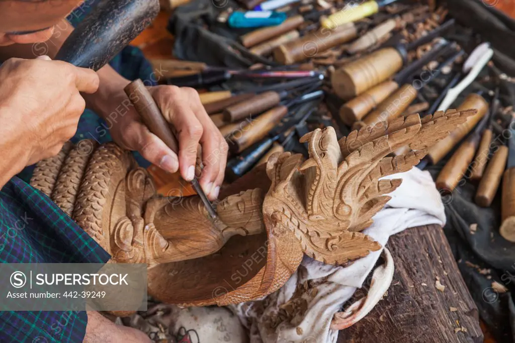 Craftsman carving a Buddha statue, Shwedagon Pagoda, Yangon, Myanmar