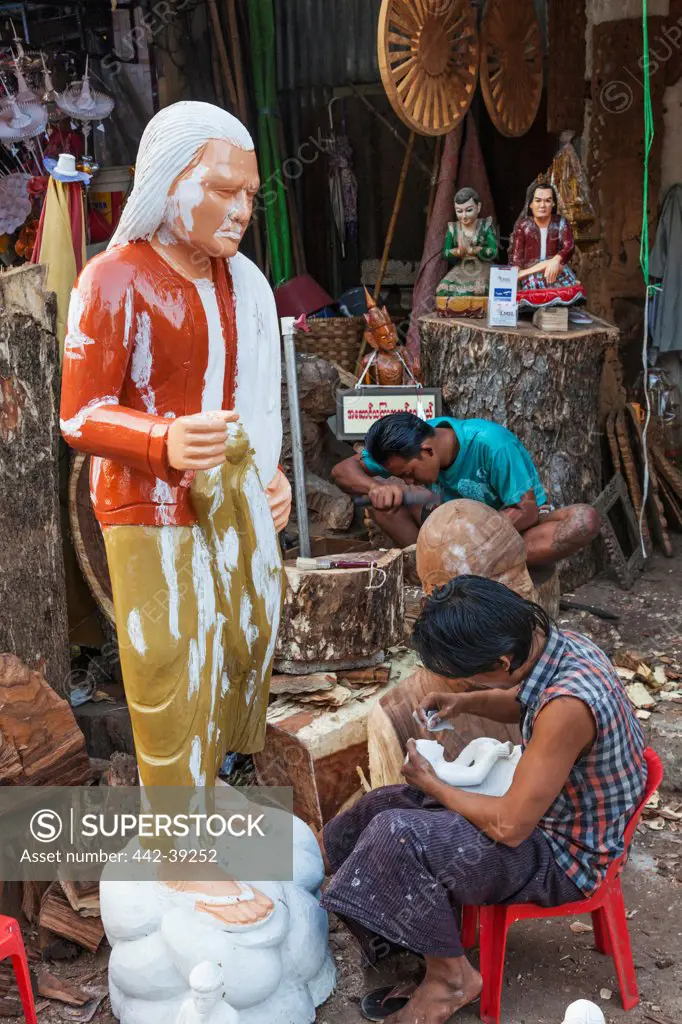 Craftsmen carving statues, Shwedagon Pagoda, Yangon, Myanmar