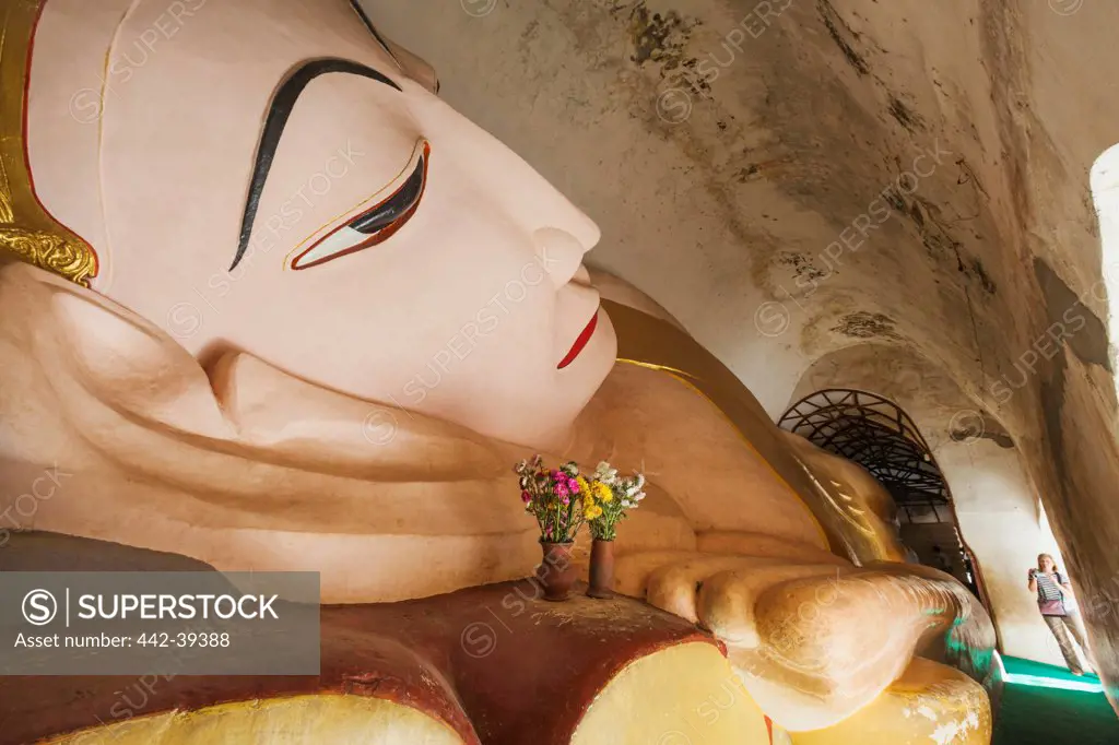 Reclining Buddha statue in a temple, Manuha Temple, Bagan, Mandalay, Myanmar