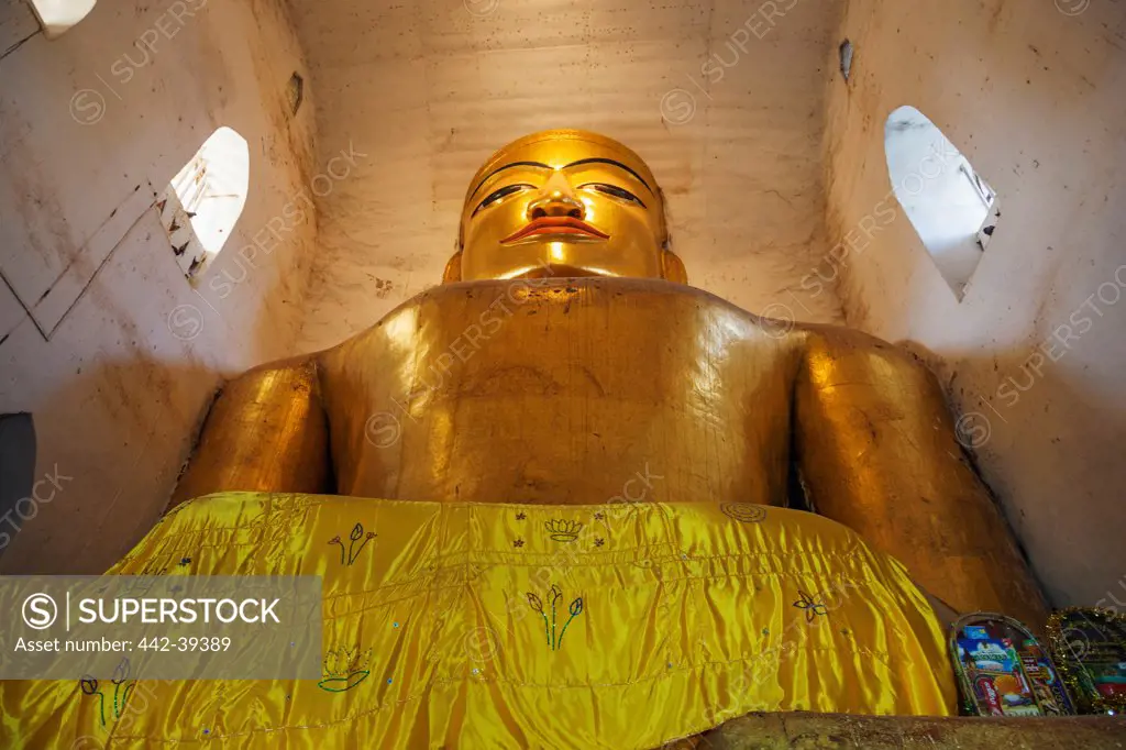 Giant Buddha statue in a temple, Manuha Temple, Bagan, Mandalay, Myanmar