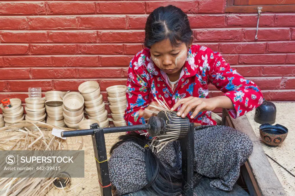 Woman making lacquerware pots, Bagan, Myanmar