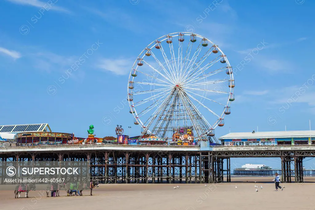 Amusement park on a pier on the coast, Central Pier, Blackpool, Lancashire, England