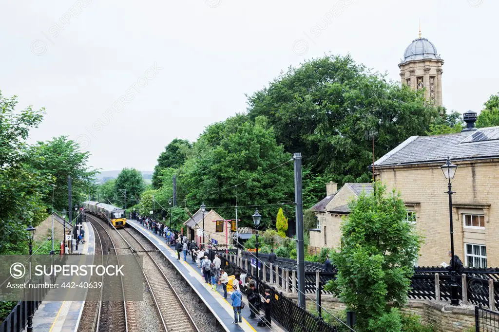 Passengers at a railroad station platform, Saltaire Train Station, Saltaire, Bradford, West Yorkshire, England