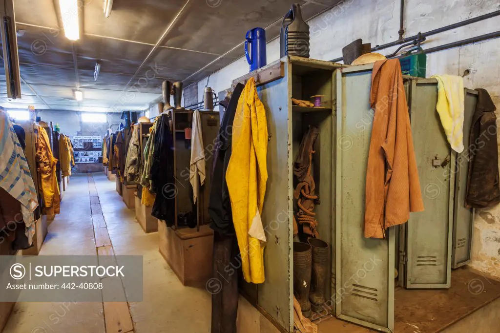 Display of worker lockers and clothing in a museum, Geevor Tin Mine, Pendeen, Cornwall, England
