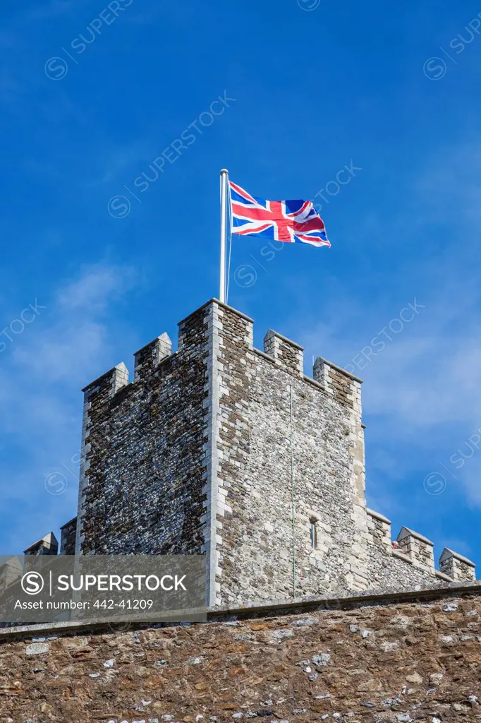 Low angle view of a British flag over a tower, The Great Tower, Dover Castle, Dover, Kent, England