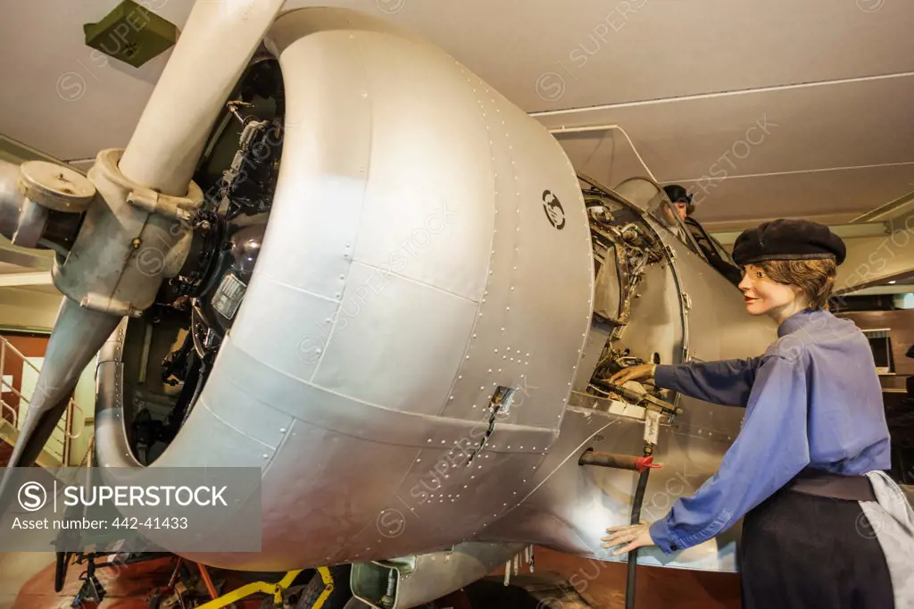 Exhibition of a female aircraft technician repairing a aircraft, Fleet Air Arm Museum, Royal Naval Air Station Yeovilton, Yeovil, Somerset, England