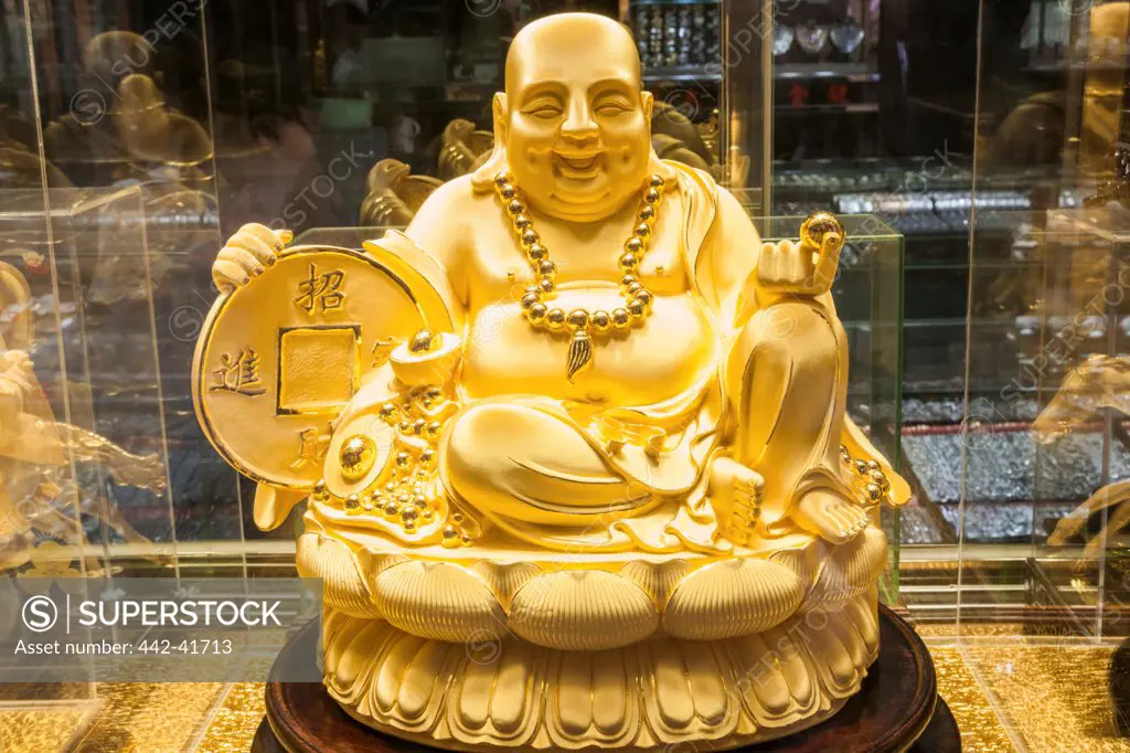 China, Macau, Gold and Jewelry Shop Window, Display of Gold Buddha Statue
