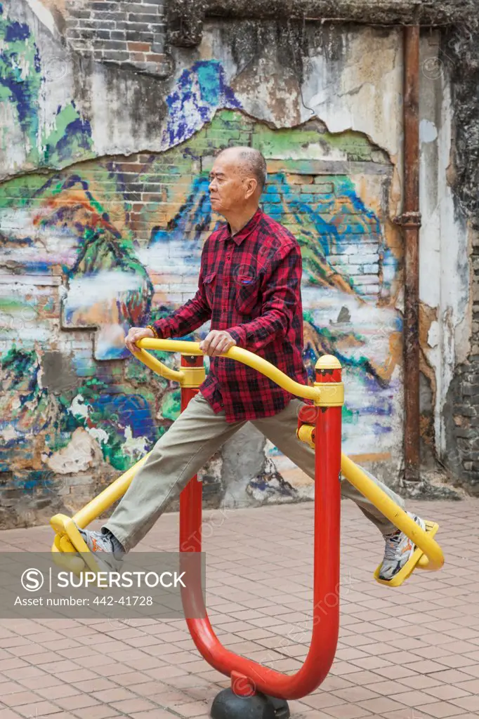 China, Macau, Elderly Man Exercising