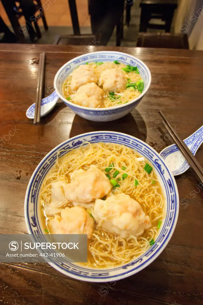 China, Hong Kong, Bowl of Dumplings and Noodles
