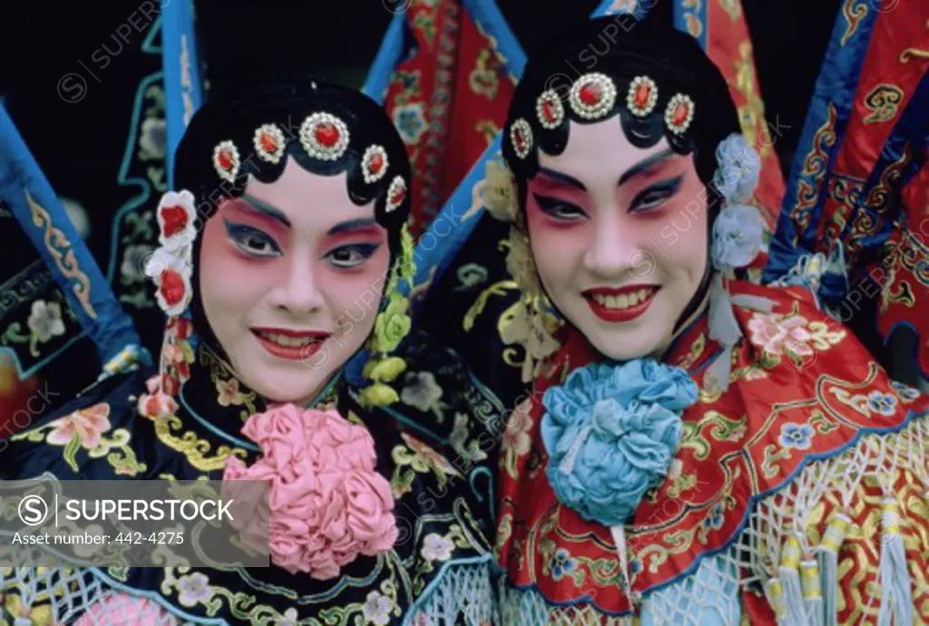 Portrait of two opera performers in costume, Shanghai, China