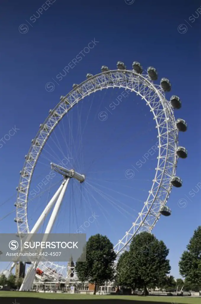Low angle view of a ferris wheel, London Eye, London, England