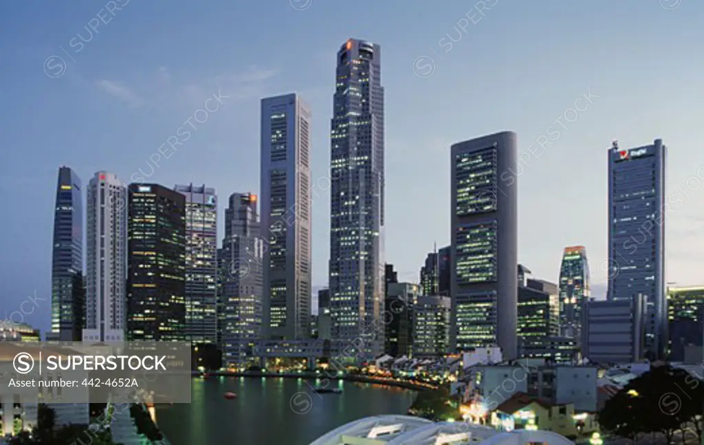Skyscrapers lit up at twilight, Singapore