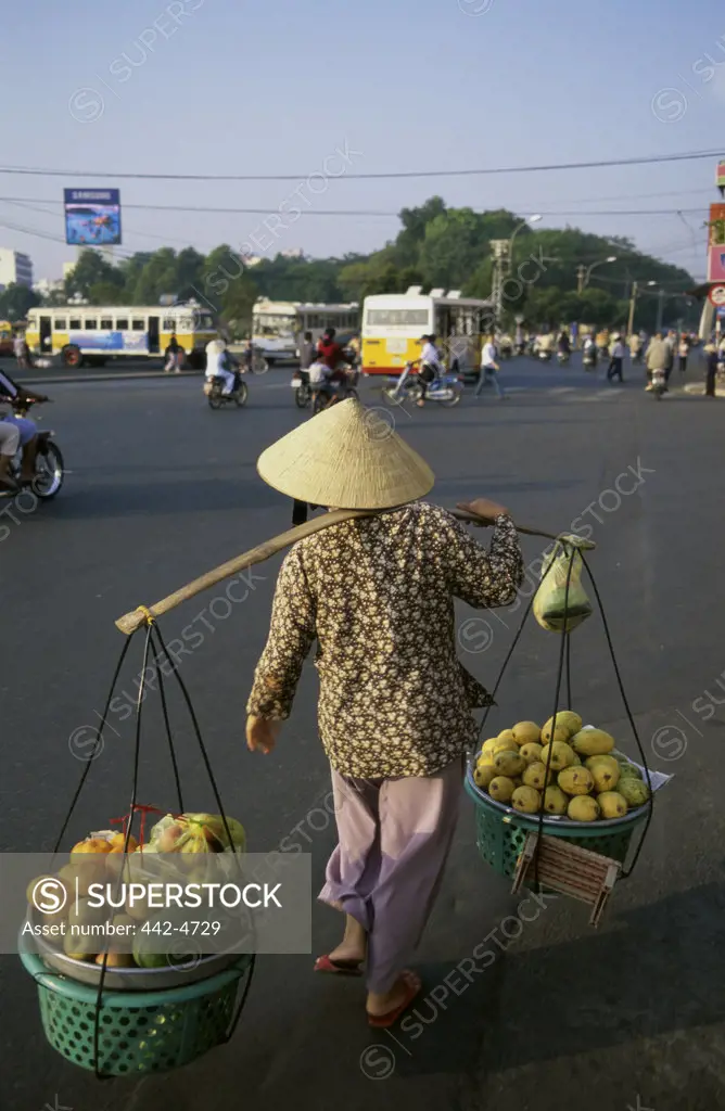 Person selling fruits and vegetables, Ho Chi Minh City, Vietnam