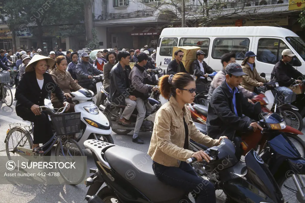 Group of people driving on a street, Hanoi, Vietnam