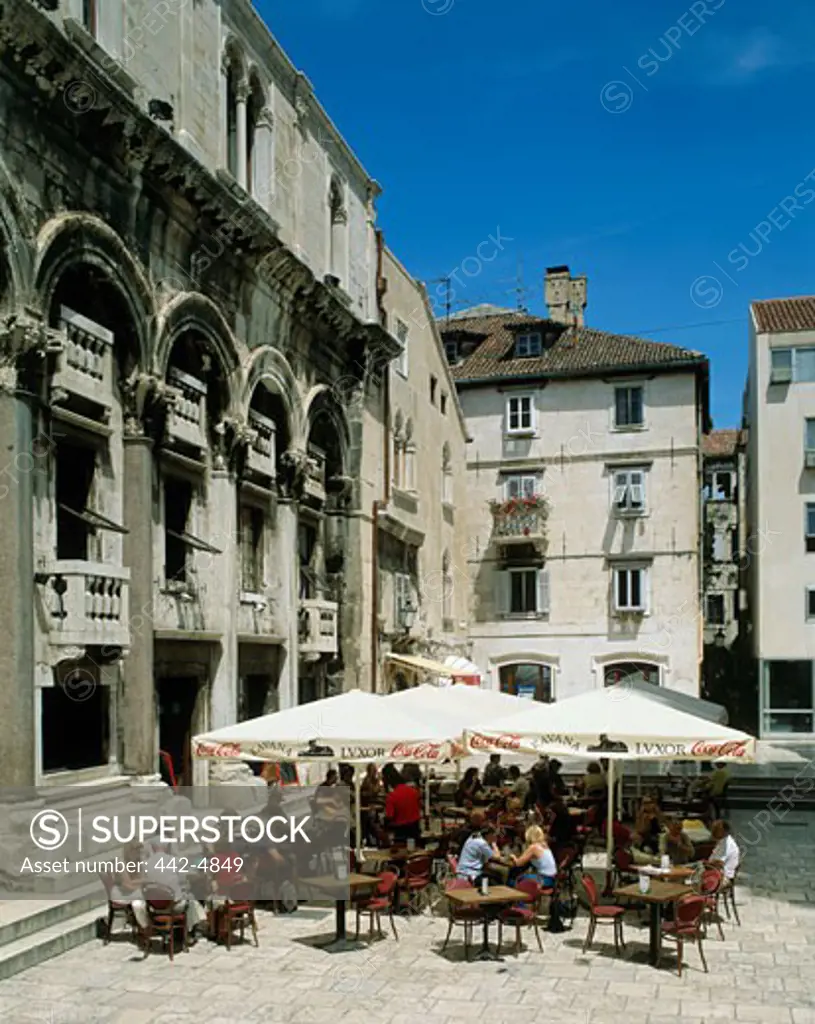 High angle view of tourists sitting at a palace, Diocletian's Palace, Split, Croatia