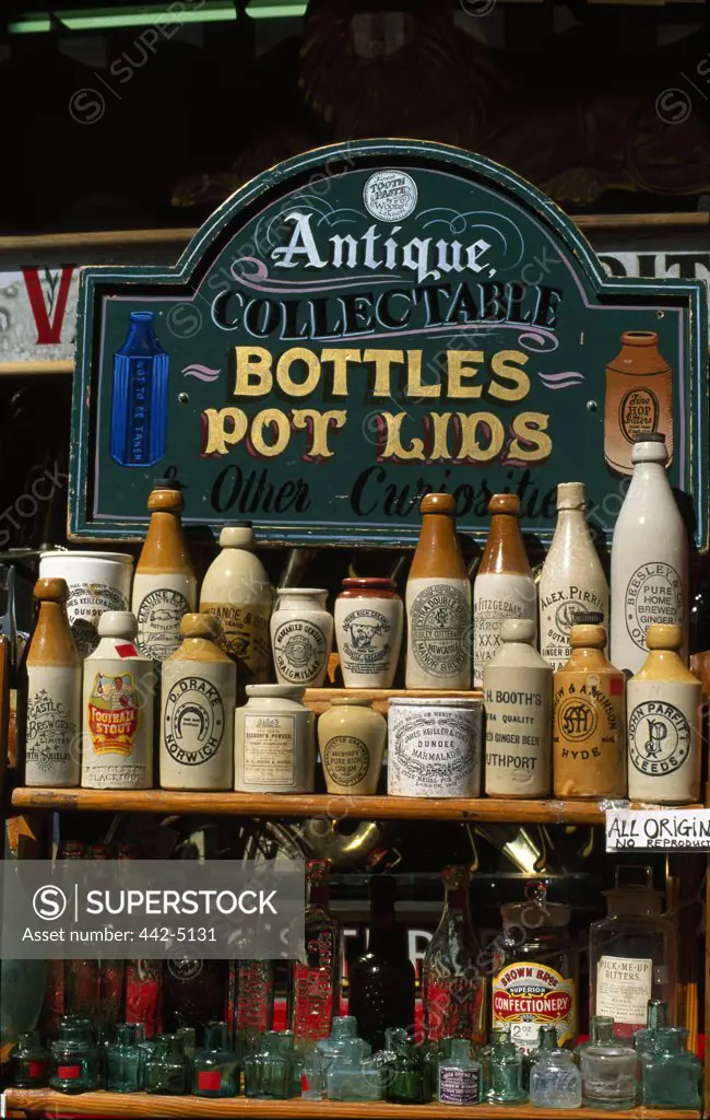 Antique merchandise displayed in a store, Portobello Road Market, London, England