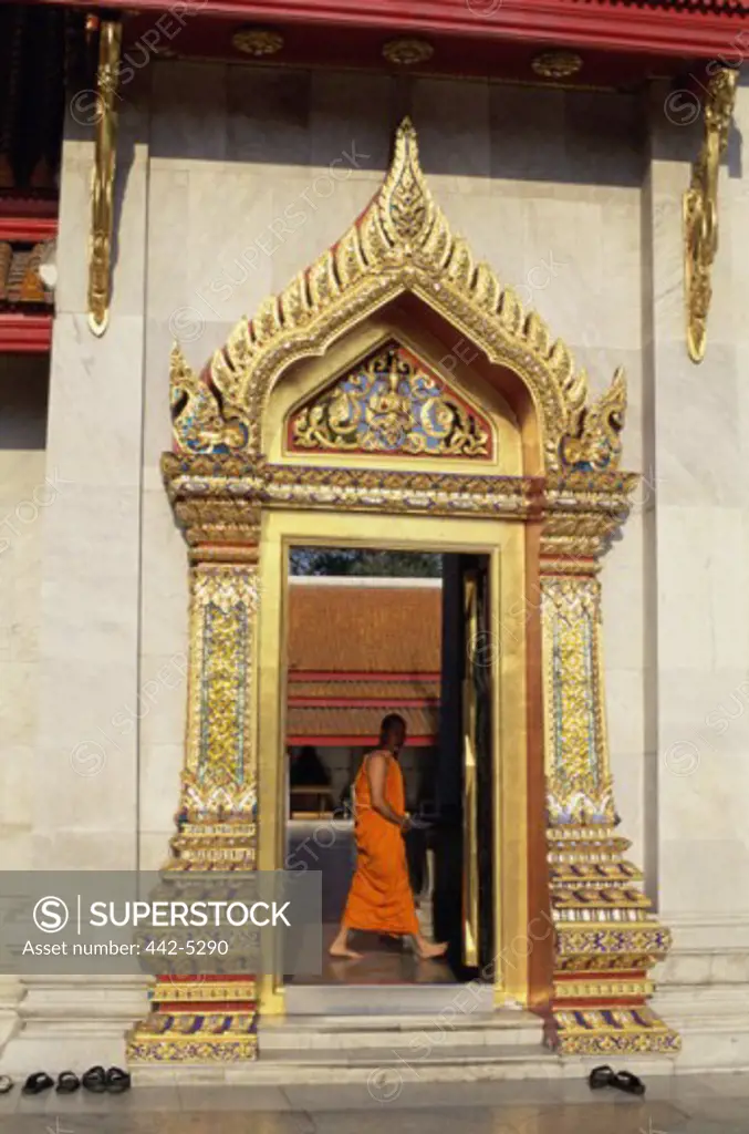 Monk walking in a temple, Wat Benchamabophit, Bangkok, Thailand