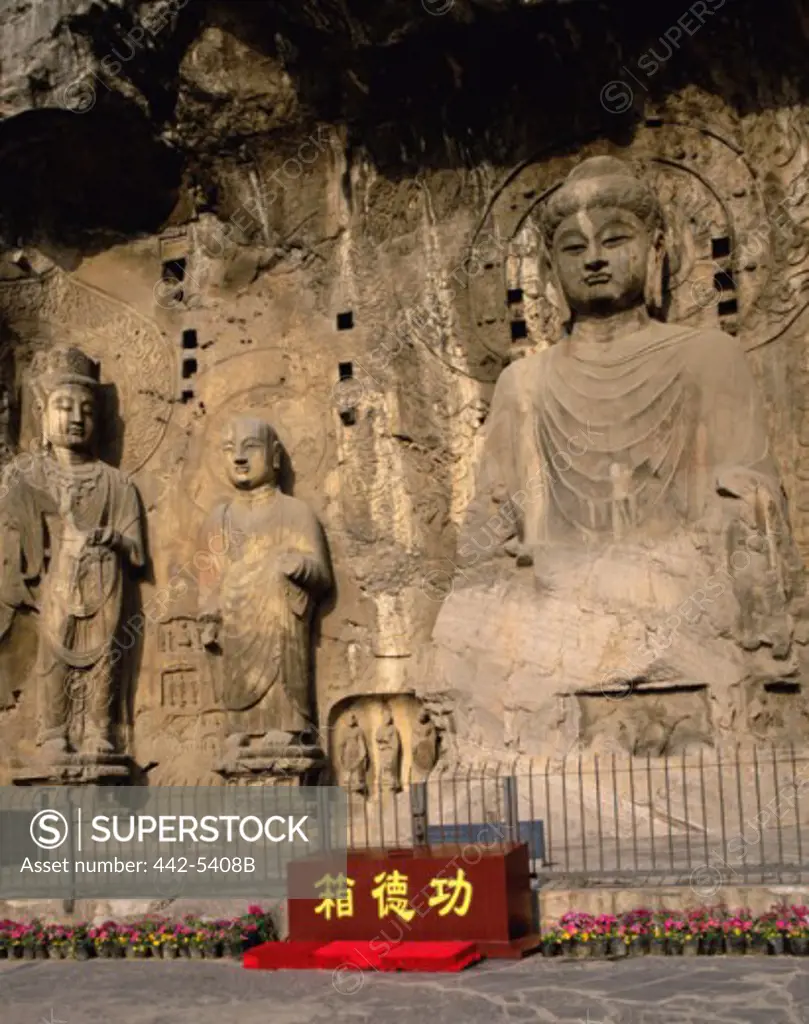 Buddha statue in a cave, Longmen Caves, Luoyang, China
