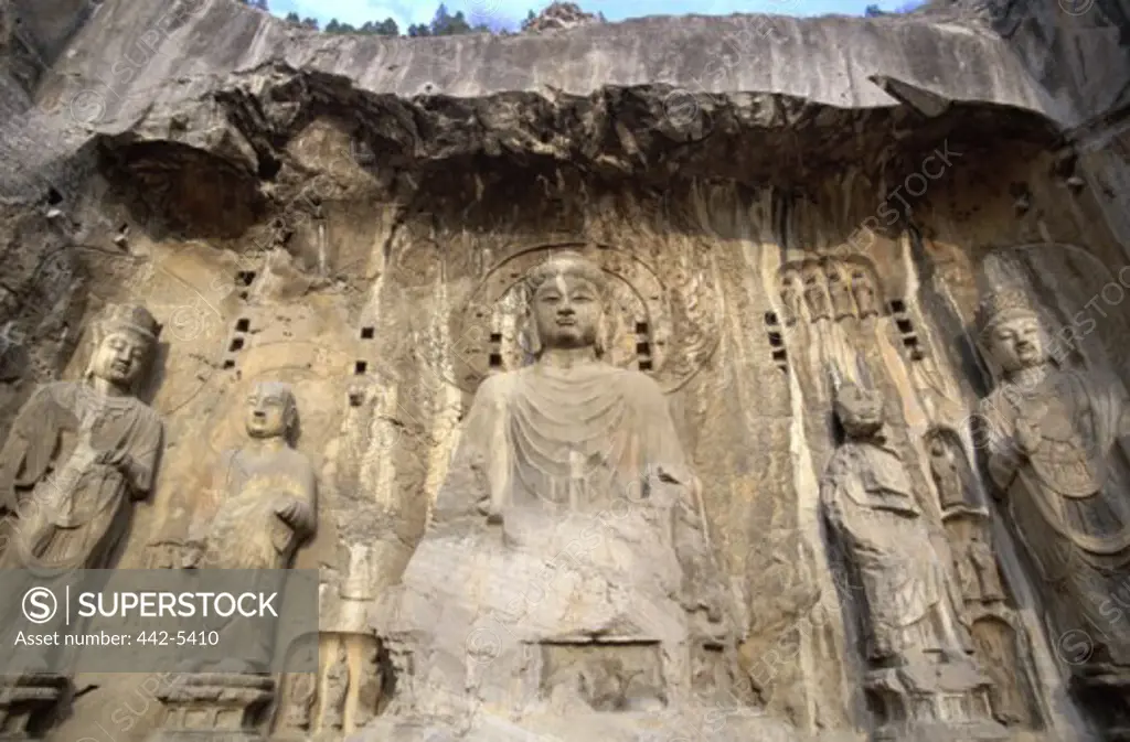 Buddha statue carved on a wall, Longmen Caves, Luoyang, China