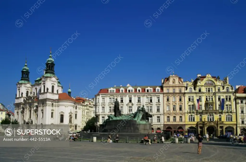 Tourists in front of a statue, Old Town Square, Prague, Czech Republic