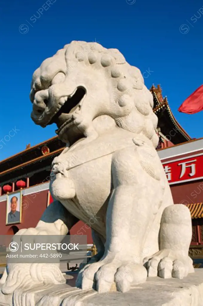 Low angle view of the statue of a lion in front of Tiananmen Gate, Tiananmen Square, Beijing, China