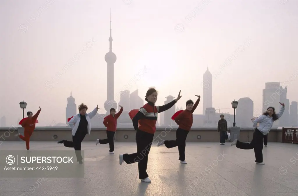 People exercising in front of Pudong, The Bund, Shanghai, China