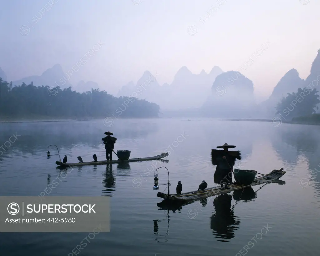 Cormorant fishermen on rafts on the Li River, Guilin, Yangshou, China