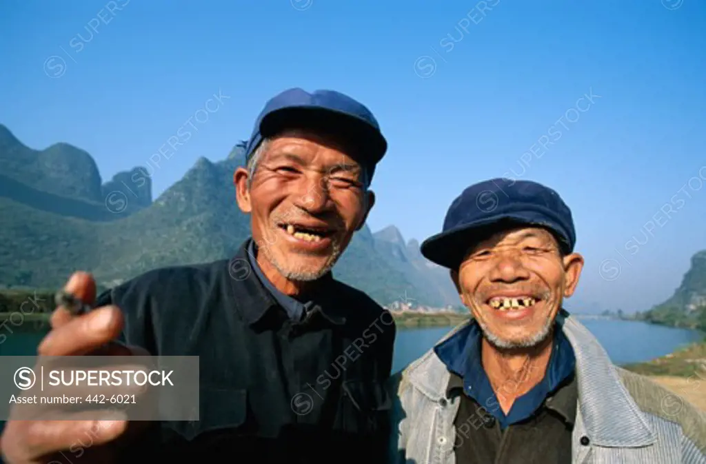 Two men dressed in Mao suits, Guilin, Yangshou, China