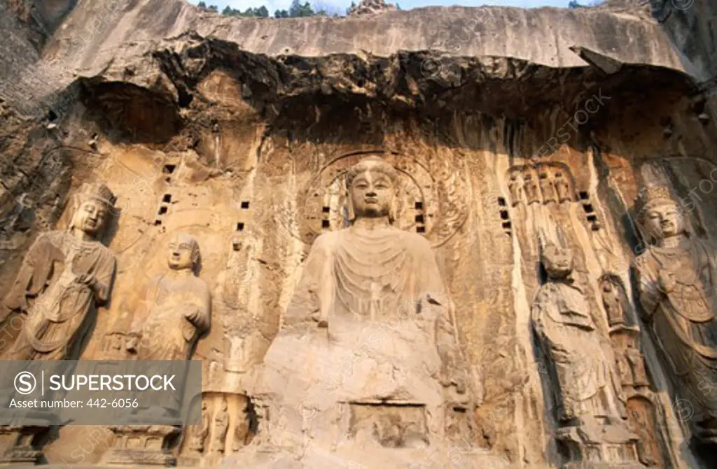 Low angle view of statues, Longmen Buddhist Caves, Ancestor Worshipping Temple, Luoyang, China