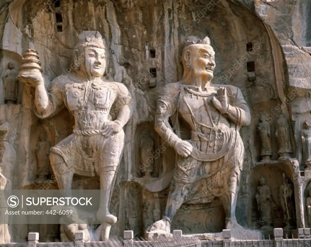 Low angle view of statues, Bodhisattva and Guardian Statues, Ancestor Worshipping Temple, Longmen Buddhist Caves, Luoyang, China