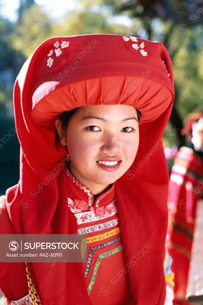 Portrait of a teenage girl dressed in a Lisu Hilltribe costume, Lisu Minority, Lijiang, China